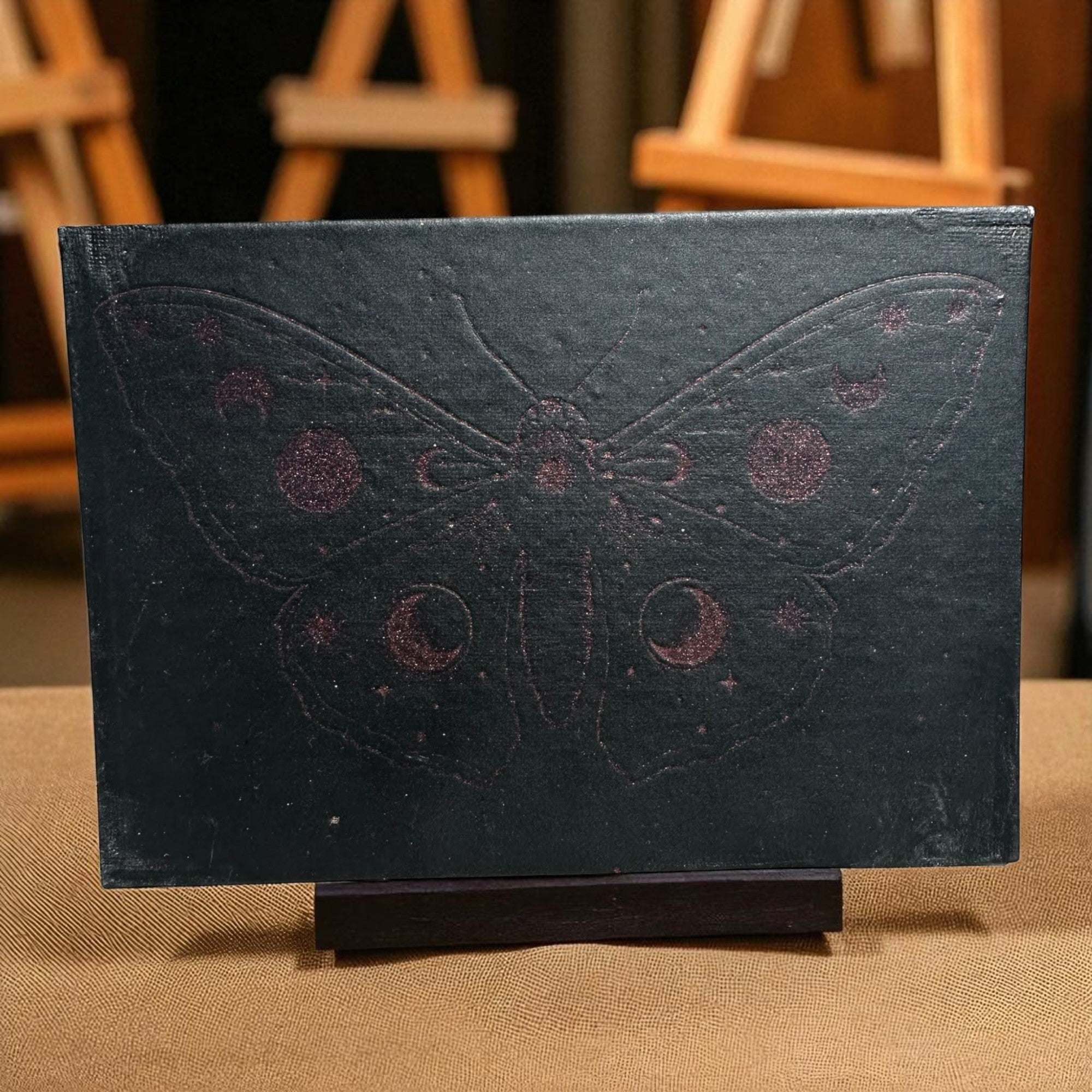 Laser-engraved 5x7 canvas art featuring a lunar butterfly design