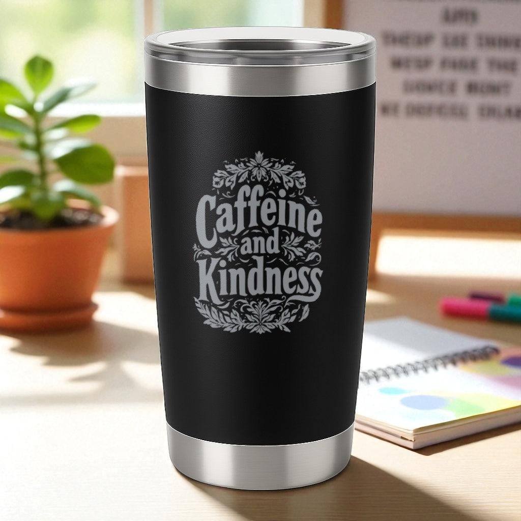 20oz black powder-coated tumbler with "Caffeine and Kindness" laser-engraved design, double-wall insulated with clear lid.