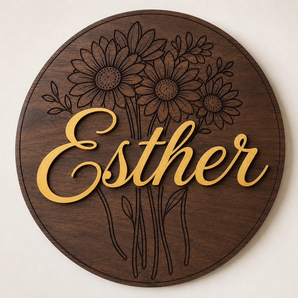 Custom floral name sign with engraved flowers and raised lettering on round wood wall decor