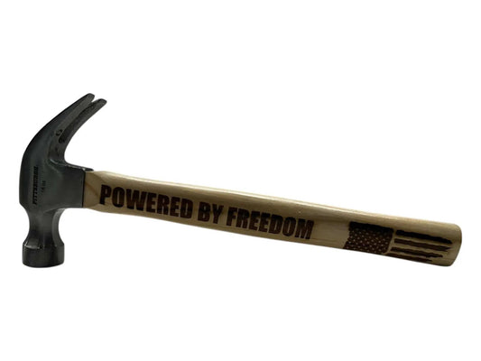 16oz engraved claw hammer with "Powered by Freedom" on wooden handle.