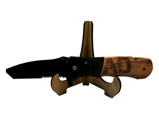 Custom Spring Assist Knife with Seatbelt Cutter, bottle opener, and glass breaker on display stand.