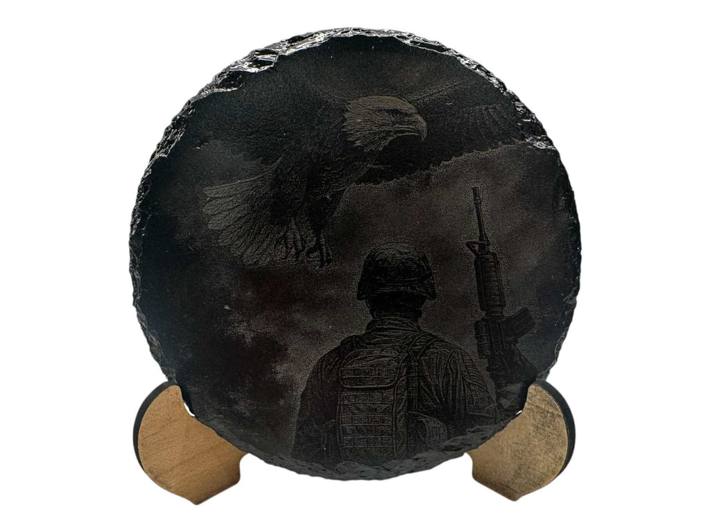 Hand-painted slate coaster with greyscale art featuring an eagle and soldier, round shape, 100mm diameter.