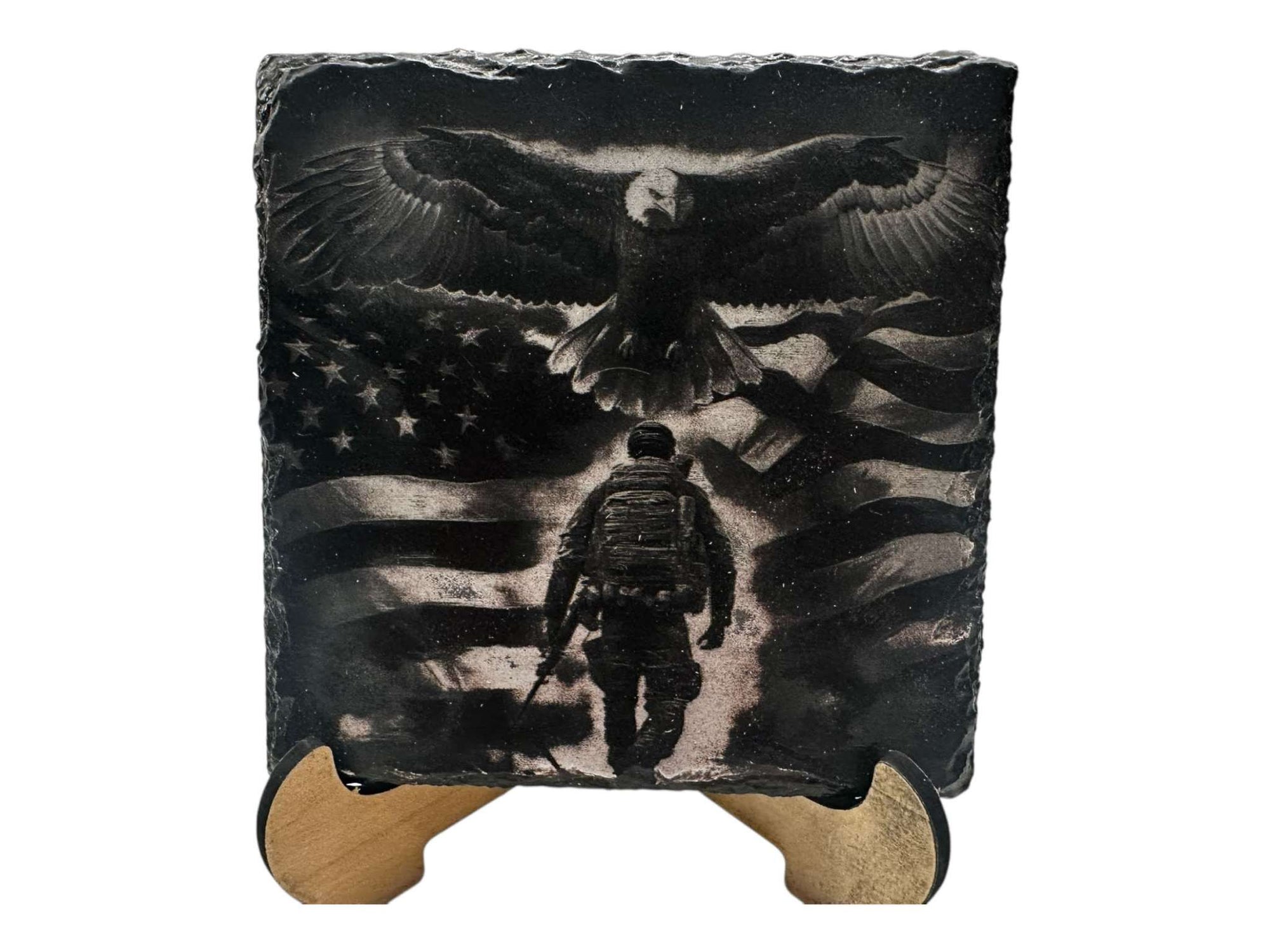 Hand-painted slate coaster with a black and white greyscale design featuring an abstract eagle and flag motif.