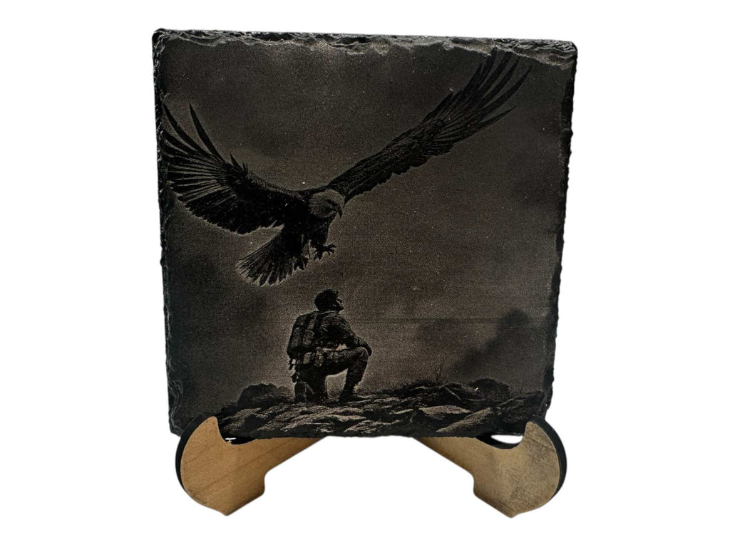 Hand-painted slate coaster with black and white greyscale eagle and figure design on a square 100mm natural slate.