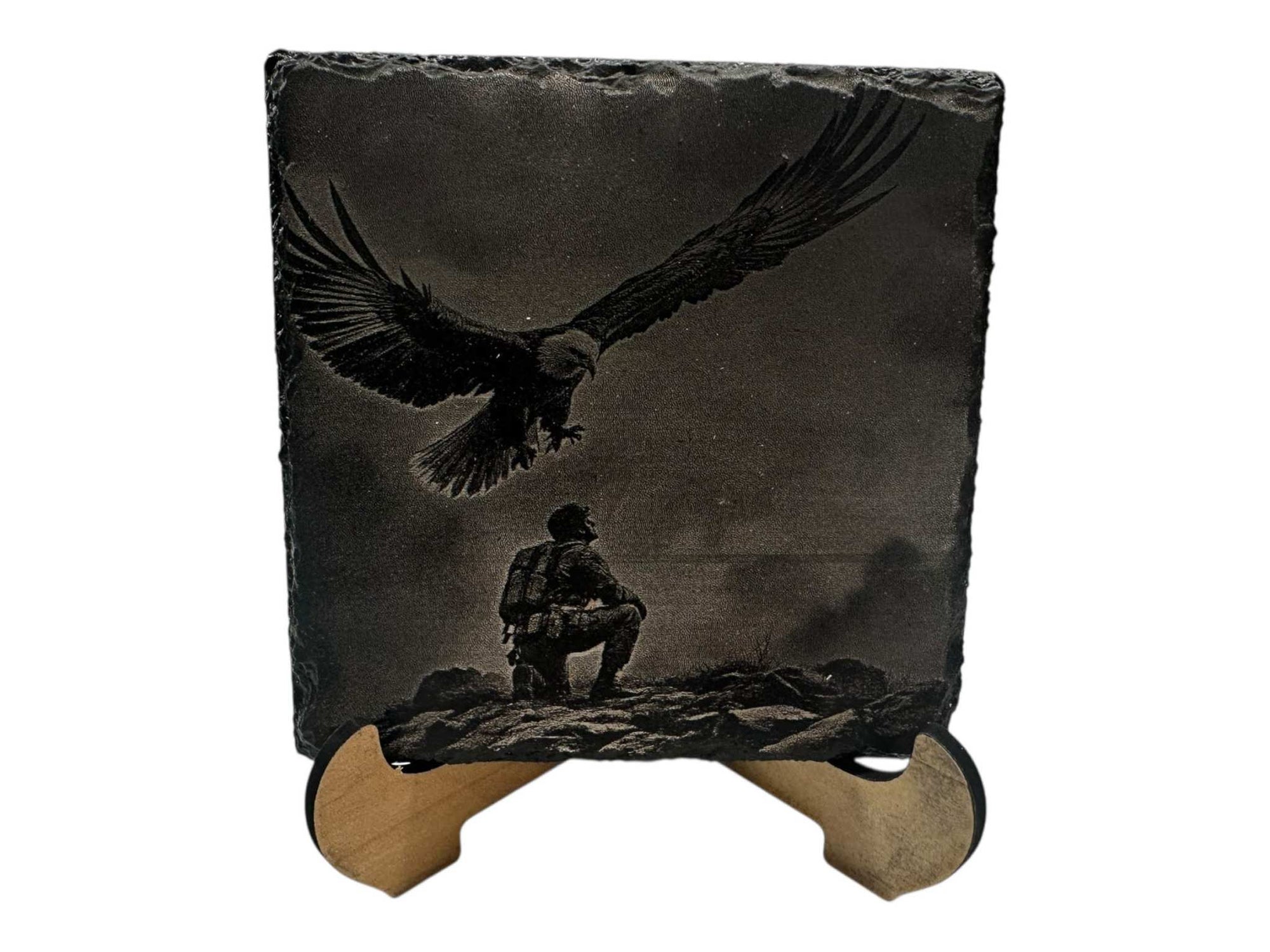 Hand-painted slate coaster with black and white greyscale eagle and figure design on a square 100mm natural slate.