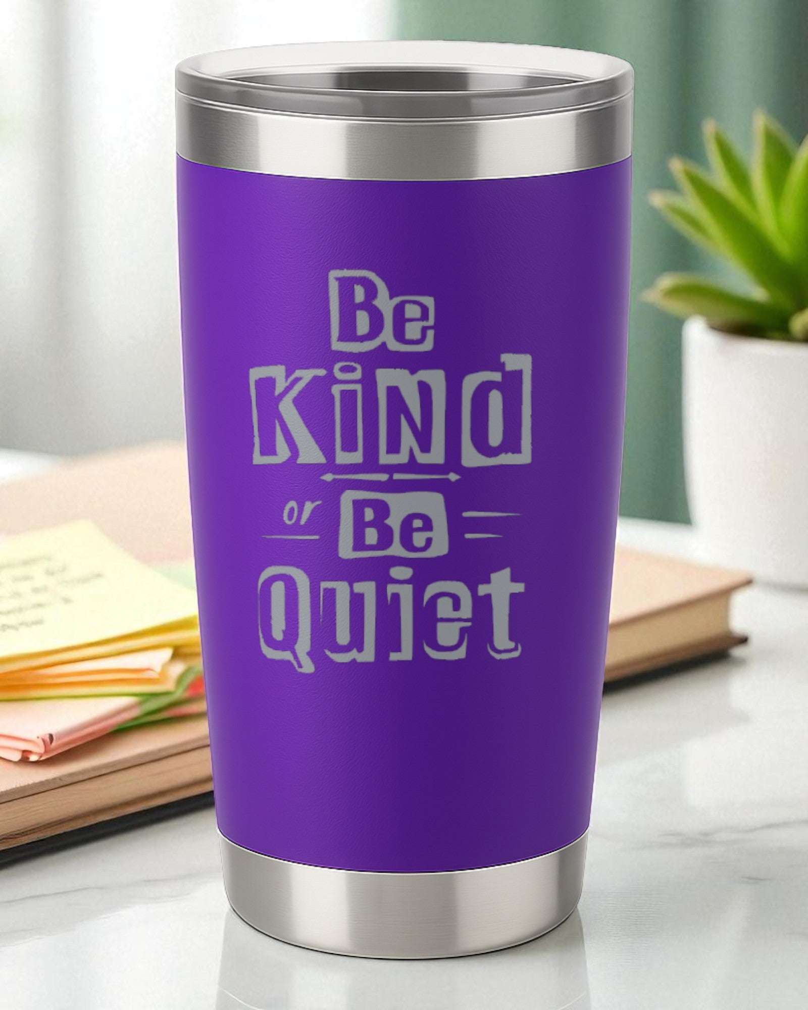 Purple tumbler with "Be Kind or Be Quiet" motivational message in bold white text