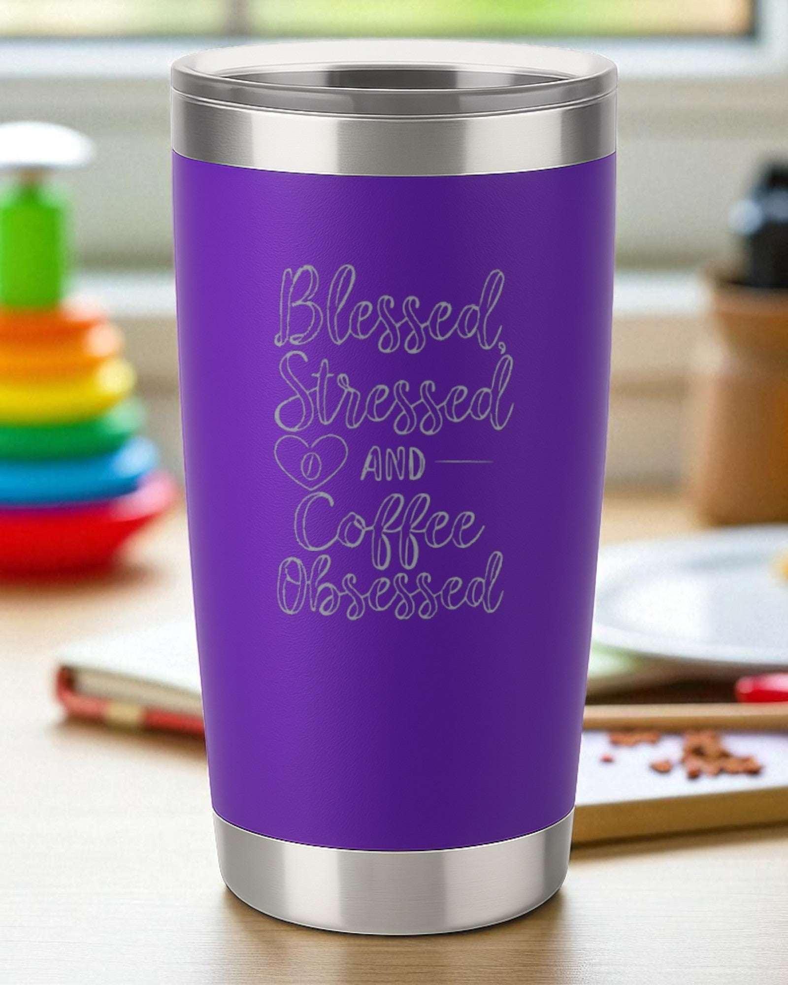 Purple script coffee tumbler engraved with "Blessed, Stressed and Coffee Obsessed" text
