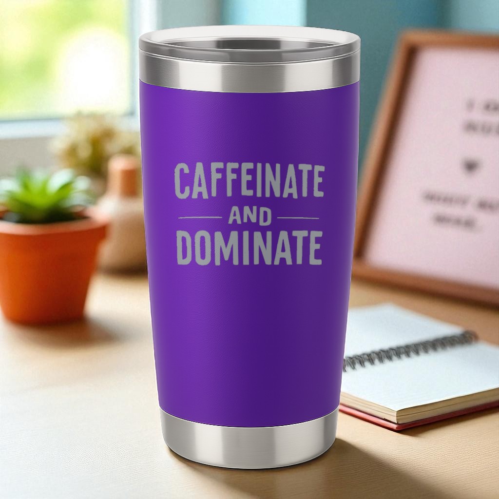 Purple 20oz stainless steel tumbler laser-engraved with "Caffeinate and Dominate" text, double-wall vacuum insulated with clear lid.