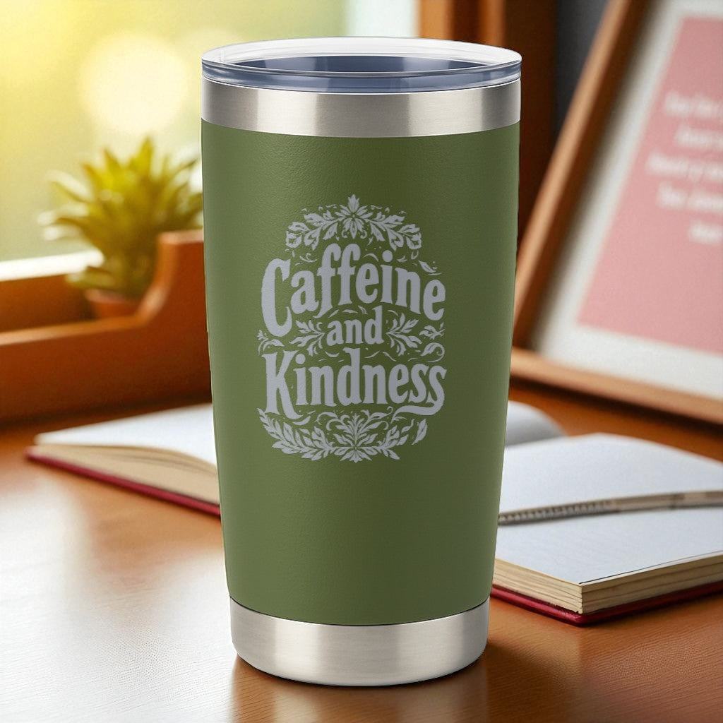 20oz green engraved tumbler with "Caffeine and Kindness" text, double-wall insulated with clear lid on desk near books