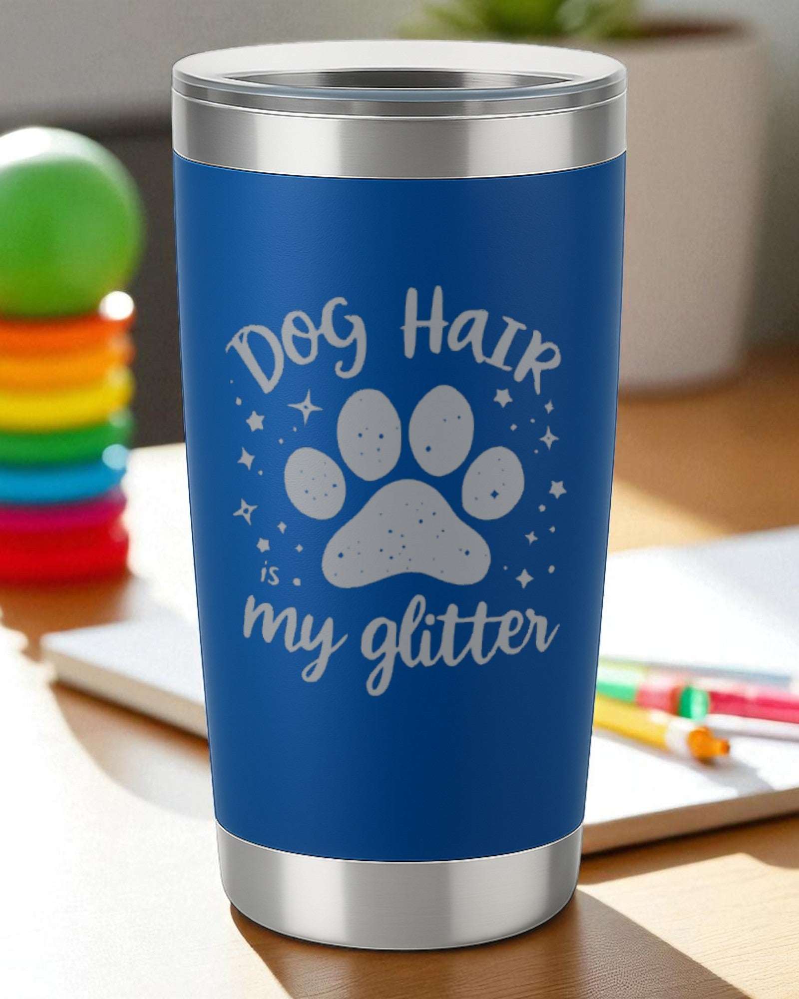 Blue tumbler with silver rim featuring "Dog Hair is My Glitter" text and paw print design for dog lovers