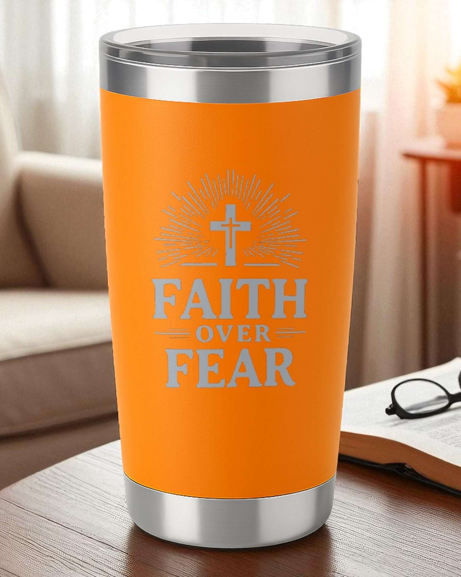 Orange inspirational Christian tumbler with Faith Over Fear text and cross design