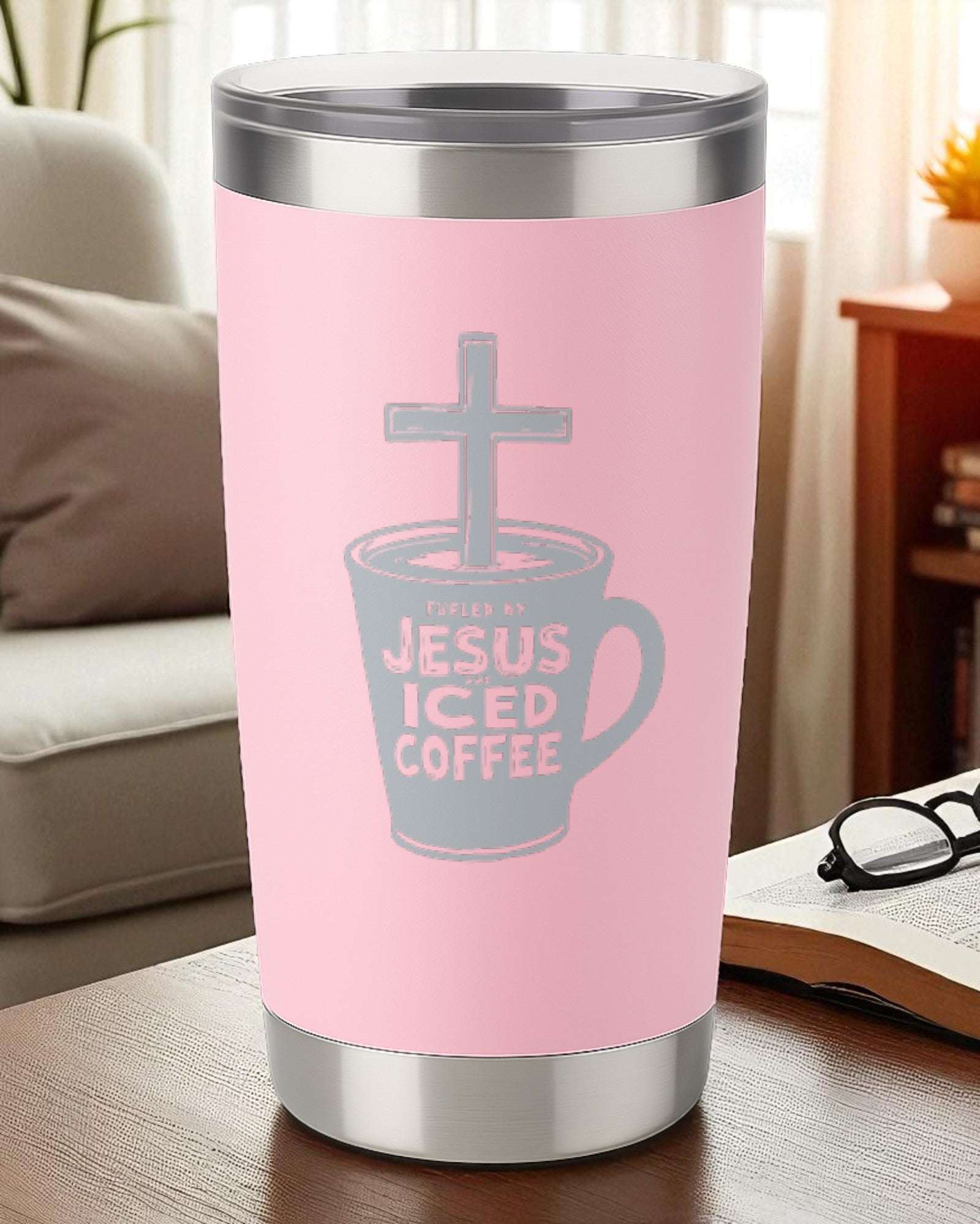 Pink Faith Tumbler engraved with "Fueled by Jesus and Iced Coffee" and cross design on stainless steel cup.