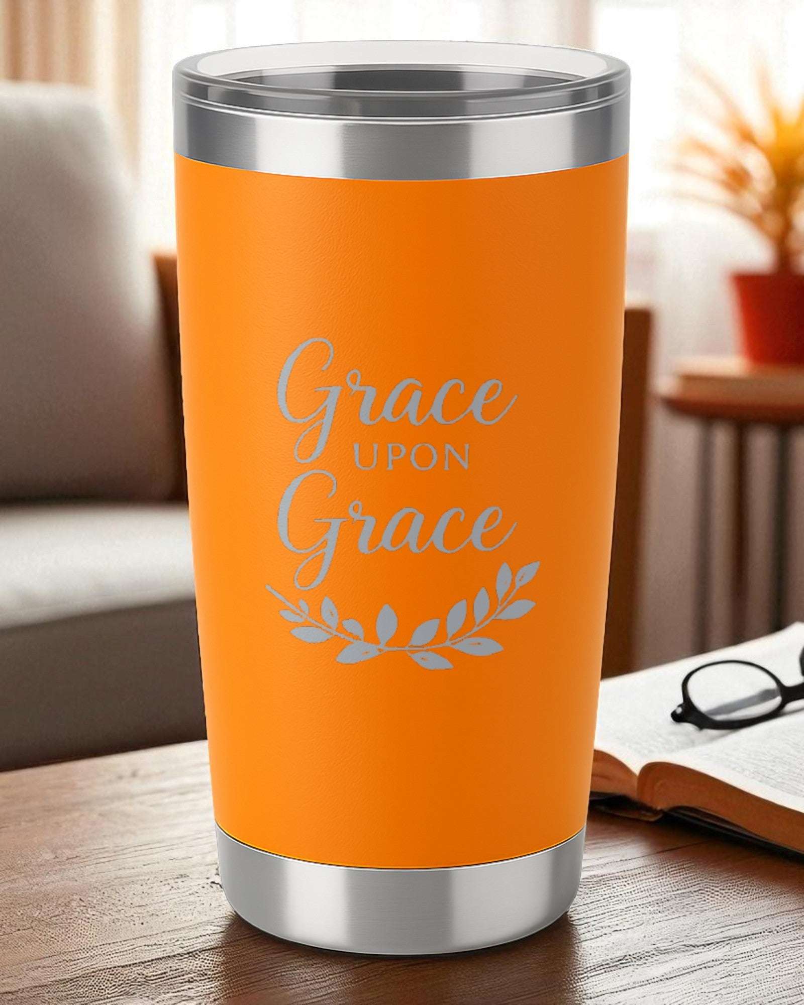 Orange minimalist tumbler with "Grace Upon Grace" faith design and silver accents