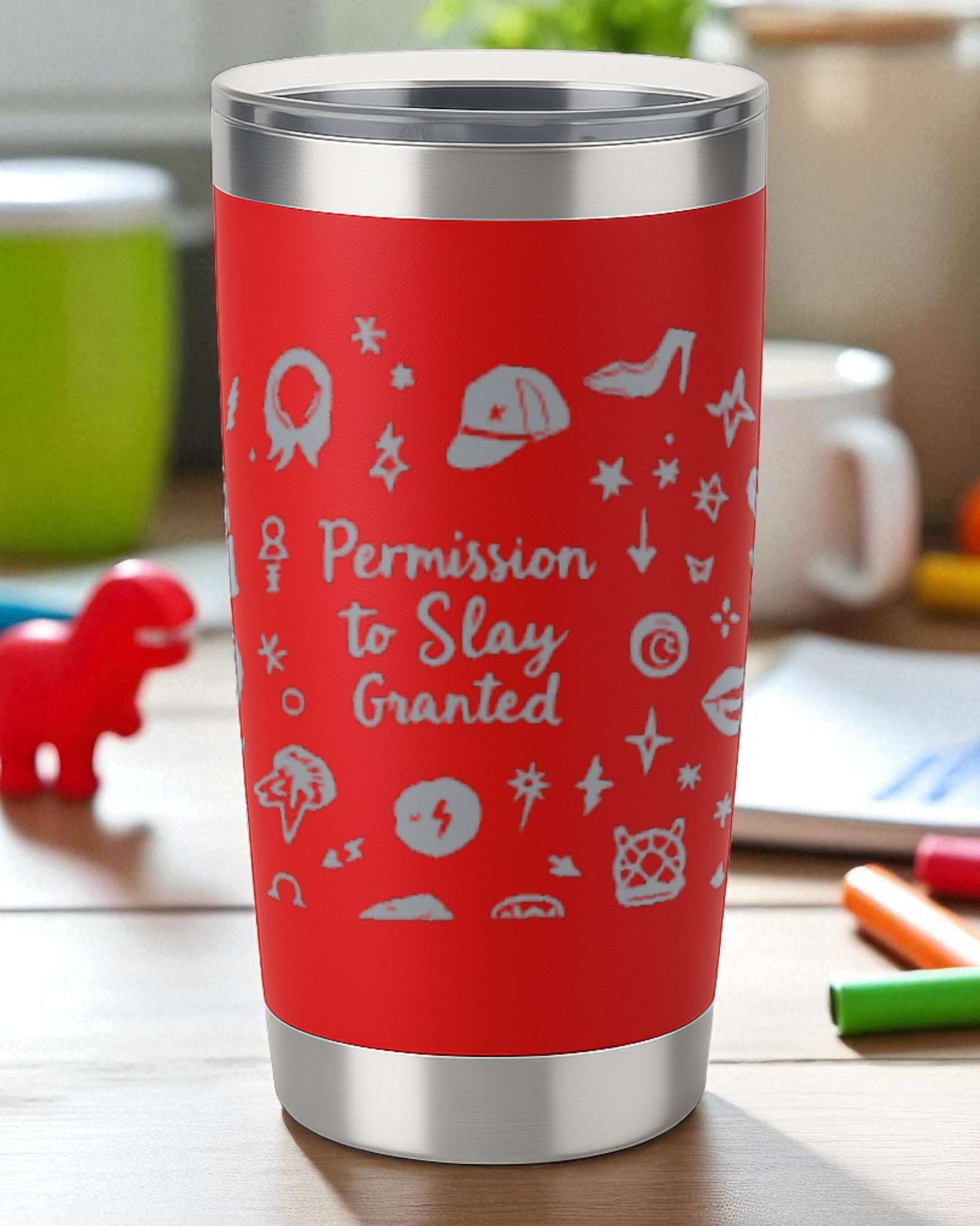 Red stainless steel tumbler with "Permission to Slay Granted" text and playful icons design