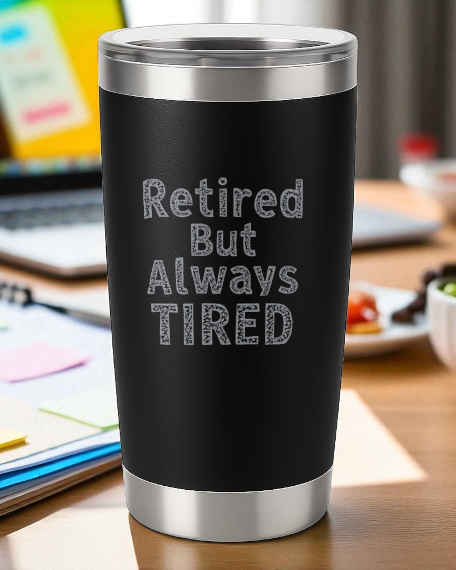 Black 20oz stainless steel tumbler engraved with "Retired But Always Tired" text, double-wall insulated with clear slide lid.