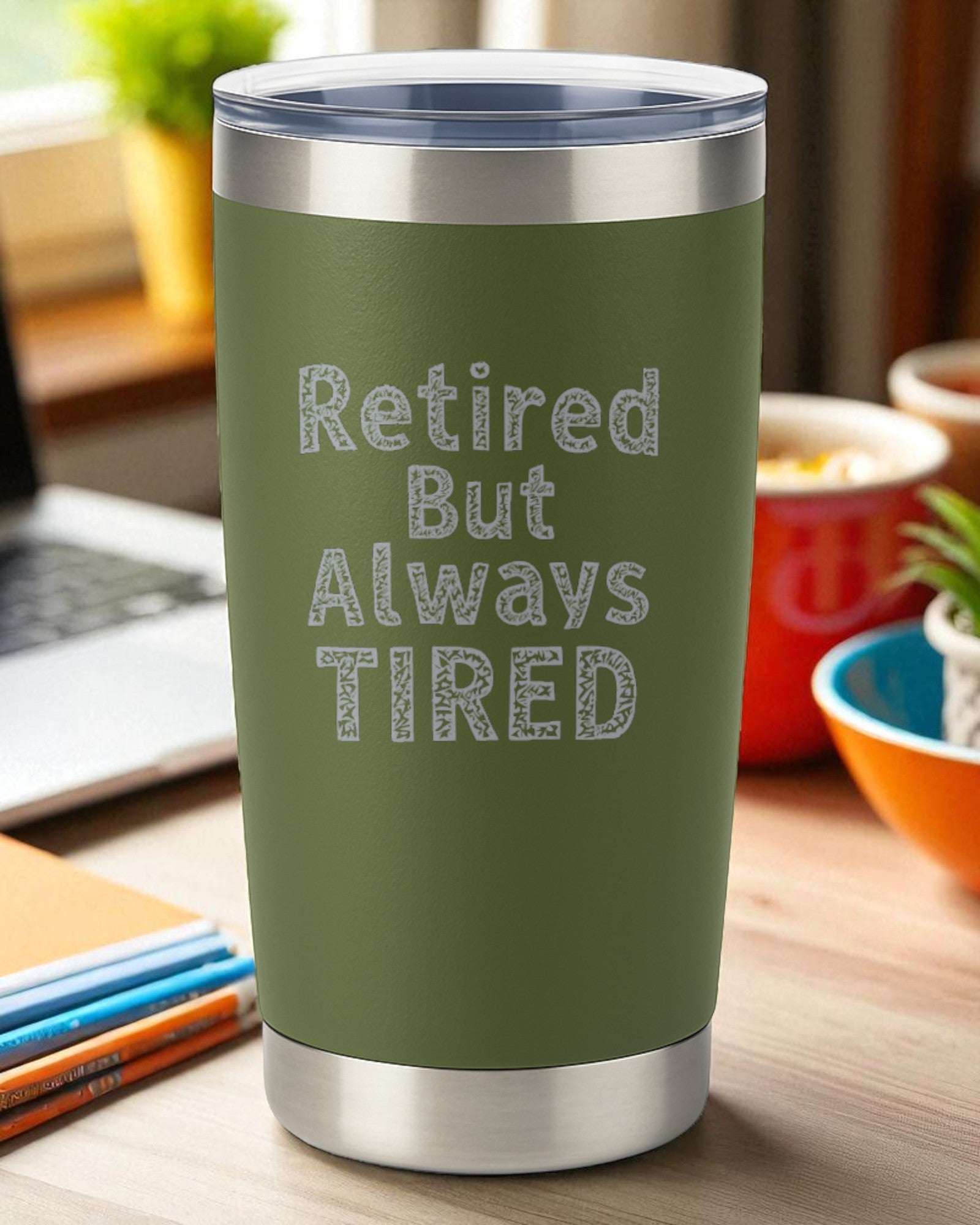 Green 20oz stainless steel tumbler with "Retired But Always Tired" engraved, double-wall insulated and clear slide lid.
