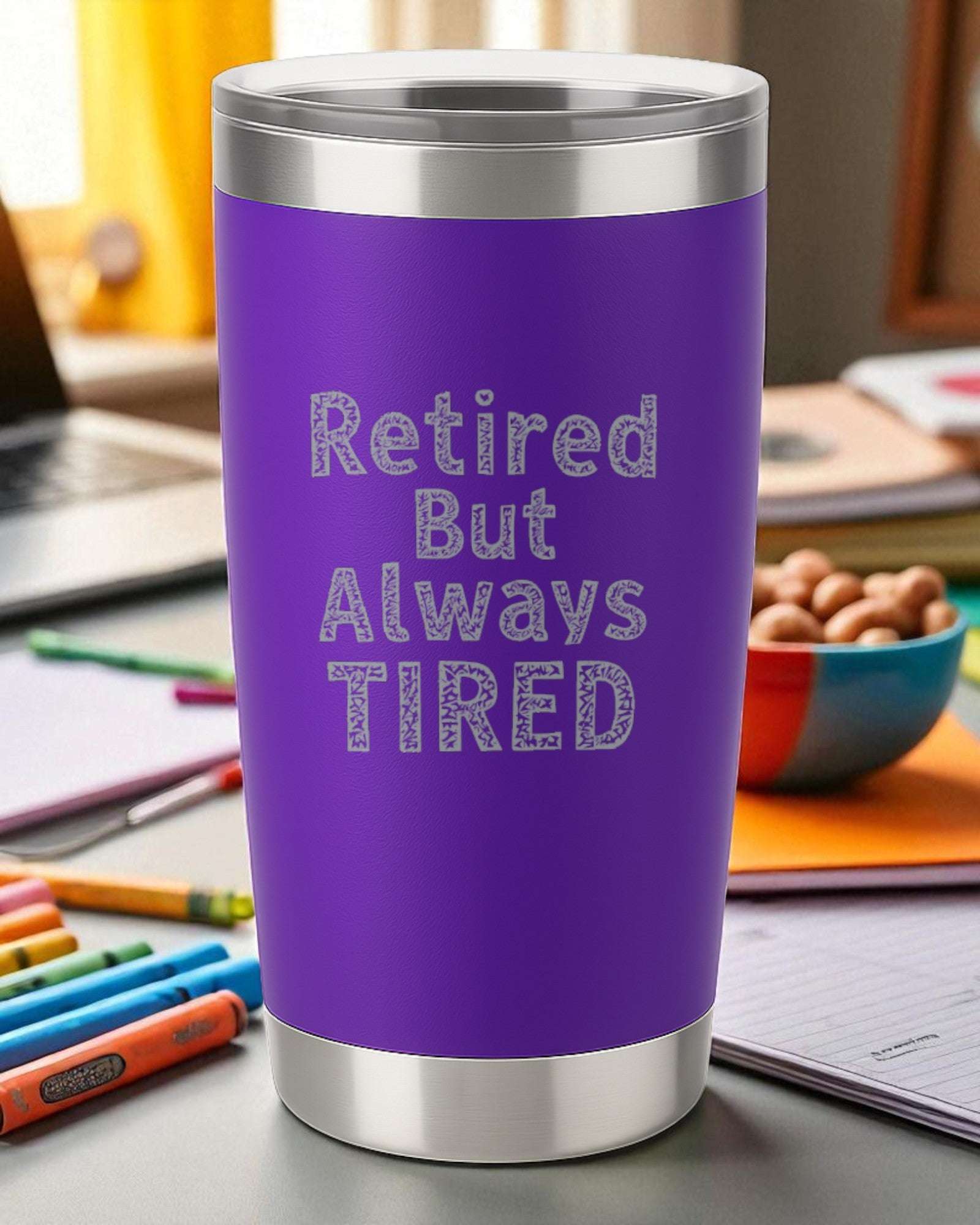 Purple 20oz stainless steel tumbler engraved with "Retired But Always Tired" phrase, double-wall insulated with clear lid.