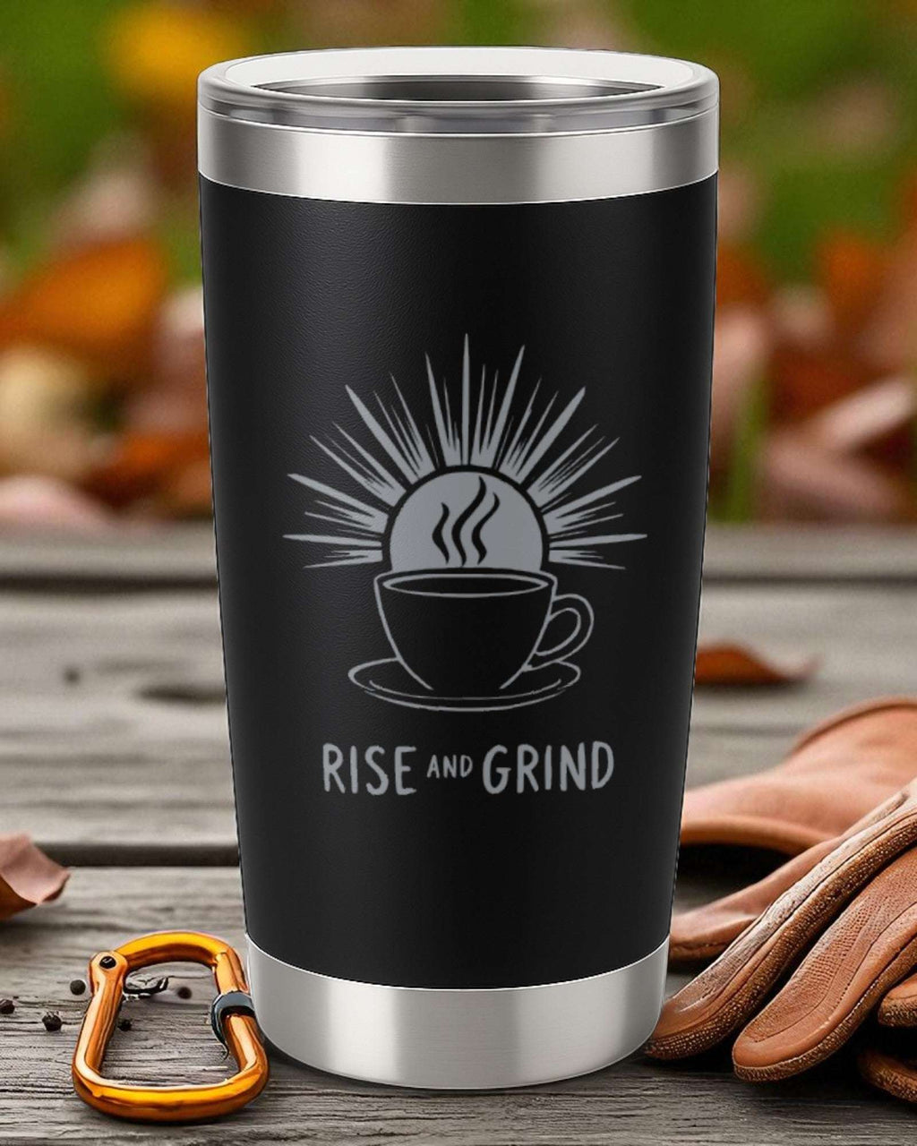 Black stainless steel coffee tumbler with "Rise and Grind" motivational design and sun graphic