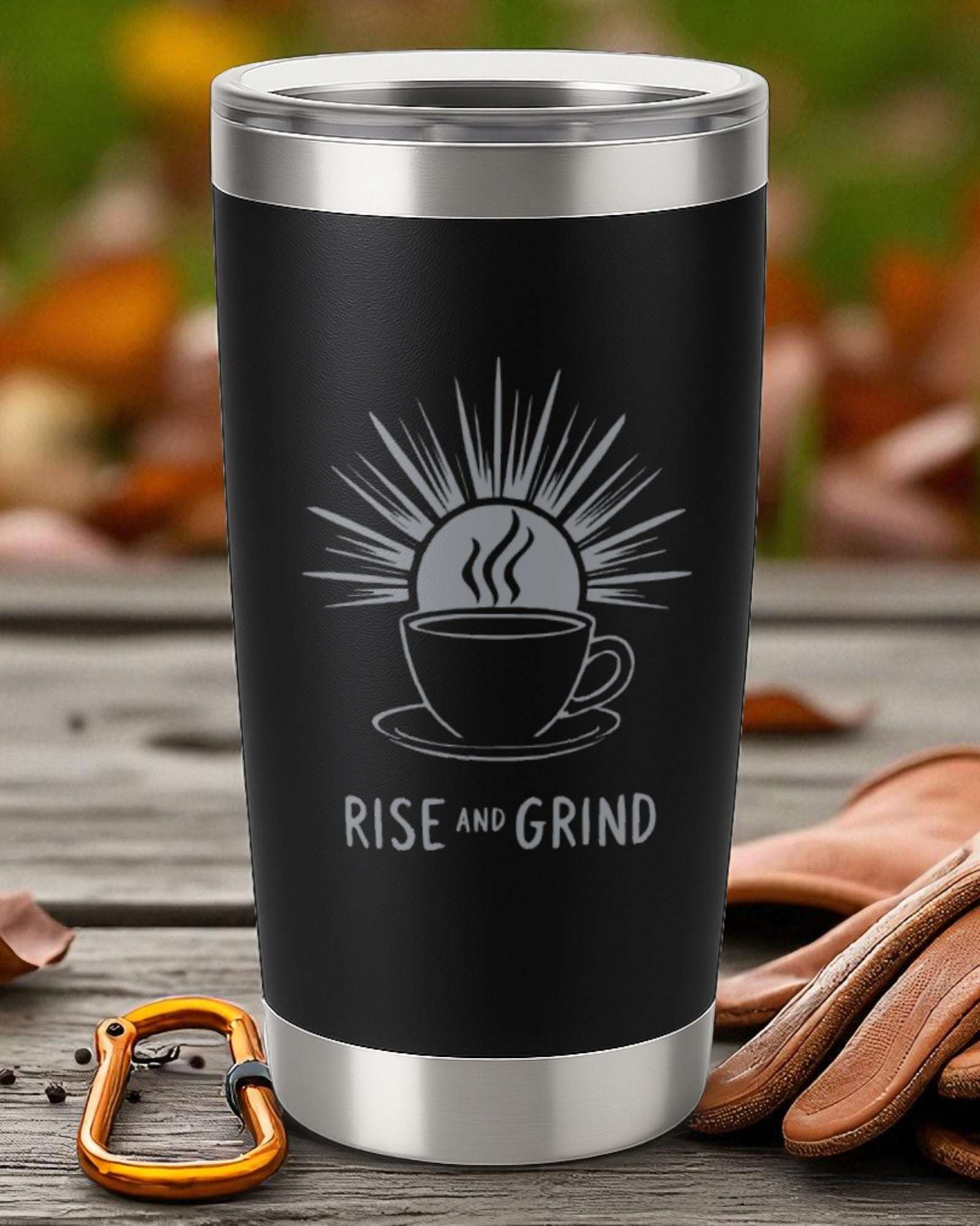 Black stainless steel coffee tumbler with "Rise and Grind" motivational design and sun graphic