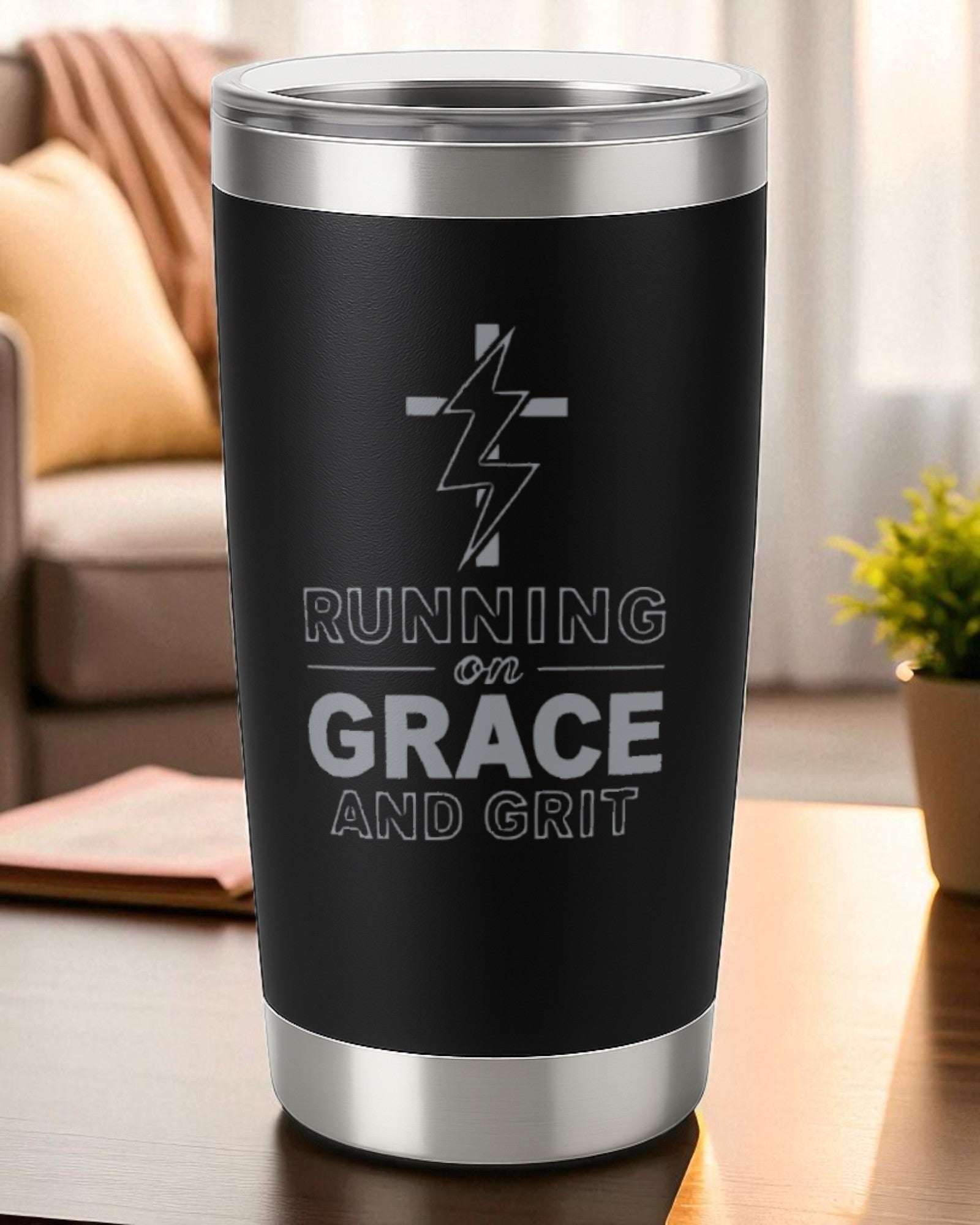20oz black engraved tumbler with "Running on Grace and Grit" text and cross lightning design, double-wall insulated and dishwasher safe.