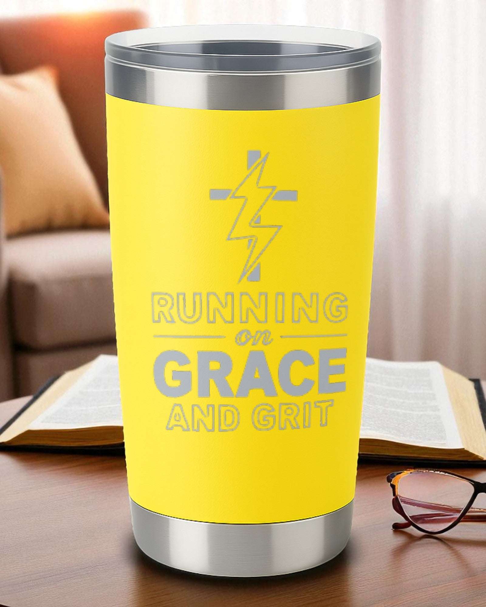 Yellow 20oz engraved tumbler with "Running on Grace and Grit" text and lightning design.