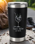 20oz black stainless steel tumbler with laser-engraved "Shhh… There’s Wine in Here" text and wine glass design, spill-resistant with clear lid.