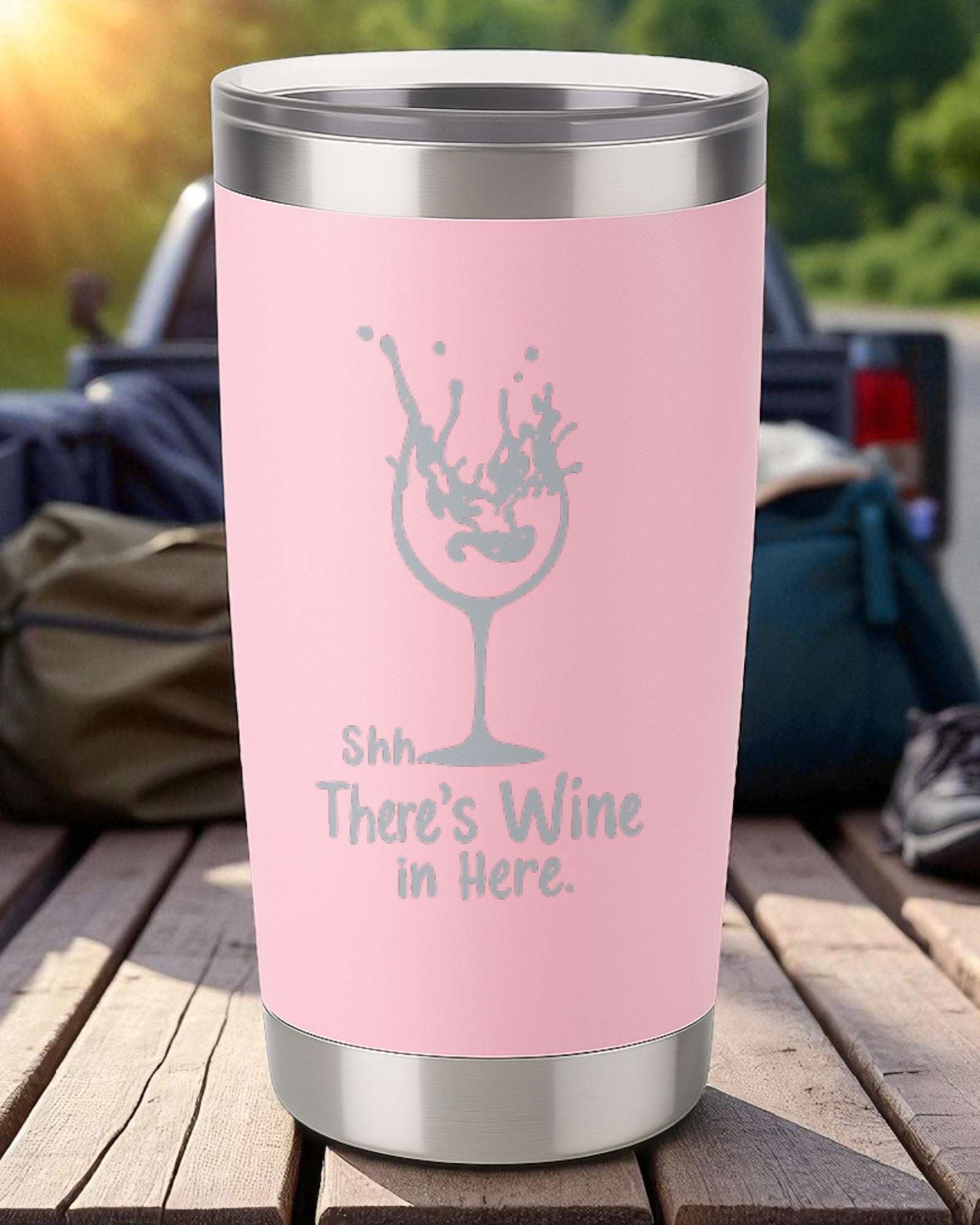 20oz pink stainless steel tumbler engraved with "Shhh… There’s Wine in Here" and a wine glass splash design
