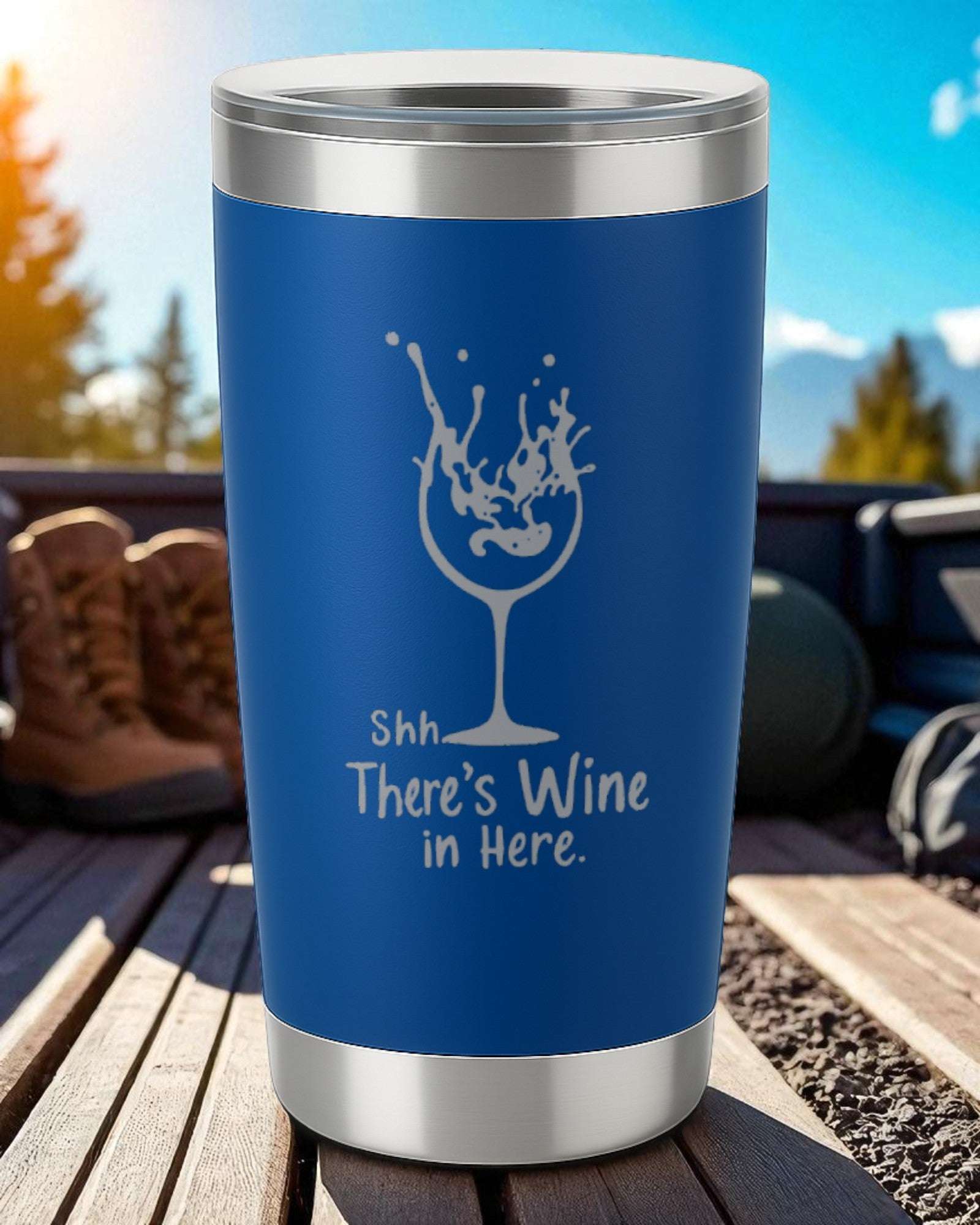 Blue 20oz stainless steel tumbler with "Shhh… There’s Wine in Here" laser-engraved and spill-resistant design.