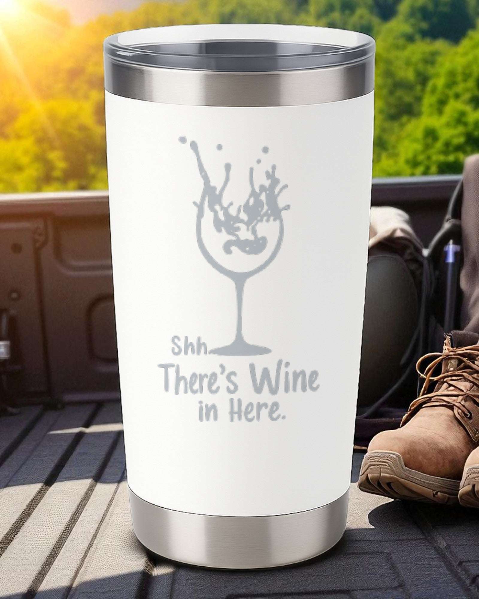 20oz white stainless steel tumbler with "Shhh… There’s Wine in Here" engraved and splash wine glass design, clear lid included