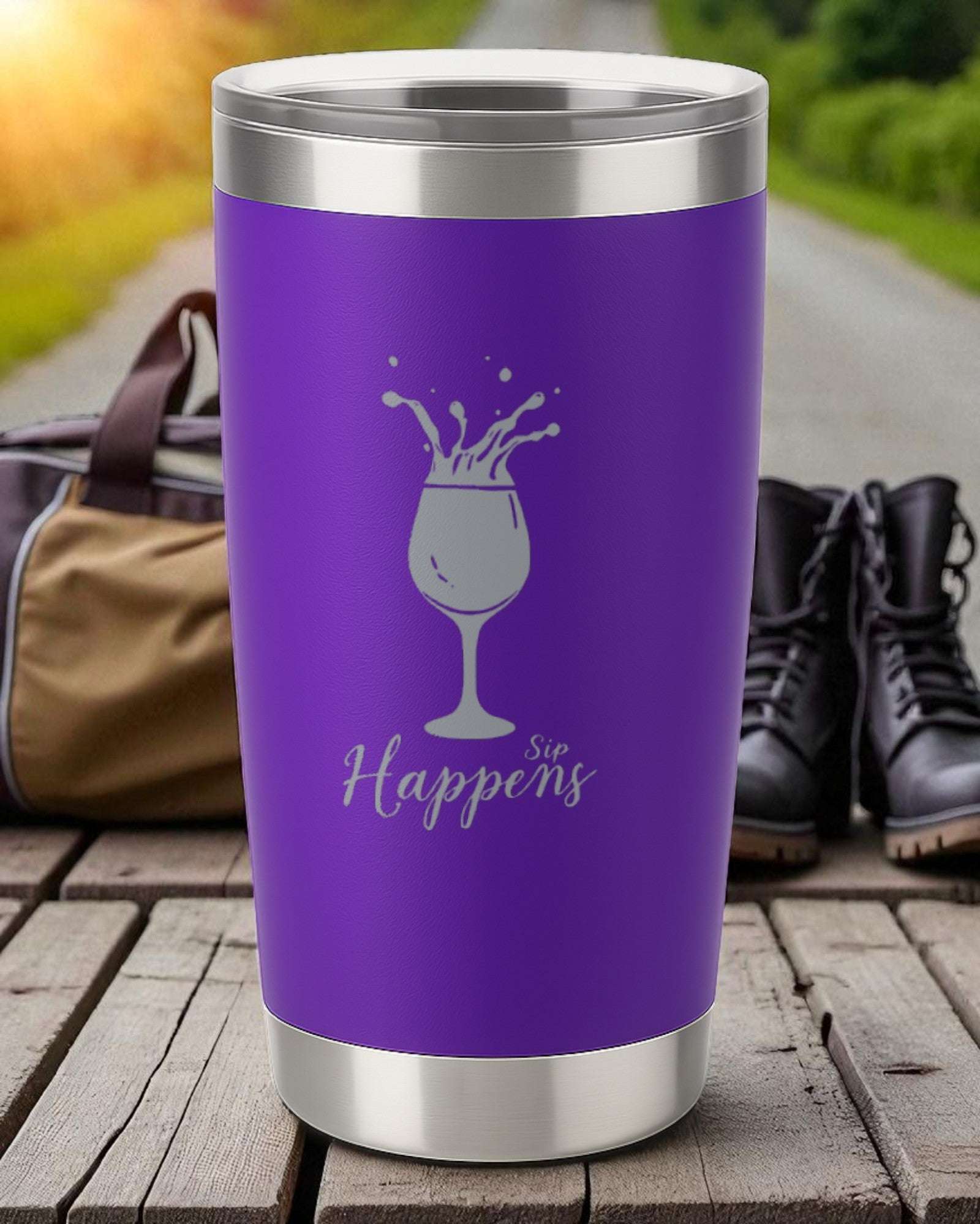 Purple 20oz insulated tumbler with "Sip Happens" laser-engraved and a wine glass splash design