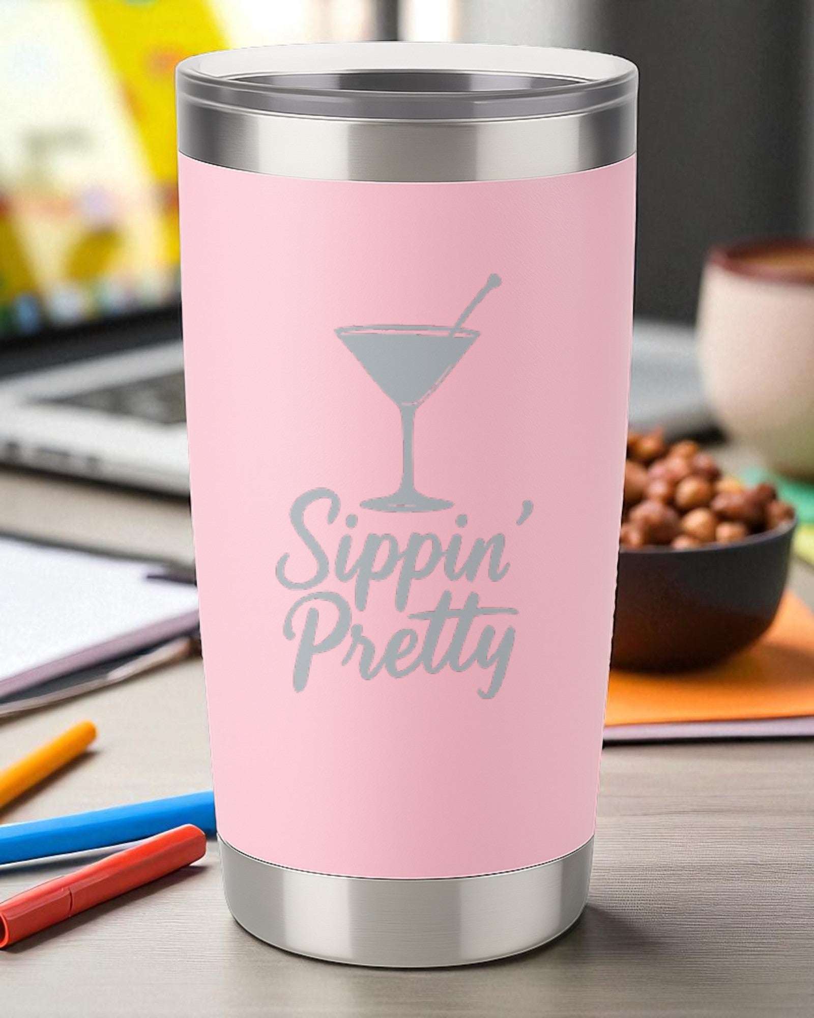Pink 20oz stainless steel tumbler engraved with "Sippin' Pretty" and a cocktail glass design, double-walled insulated with clear lid.