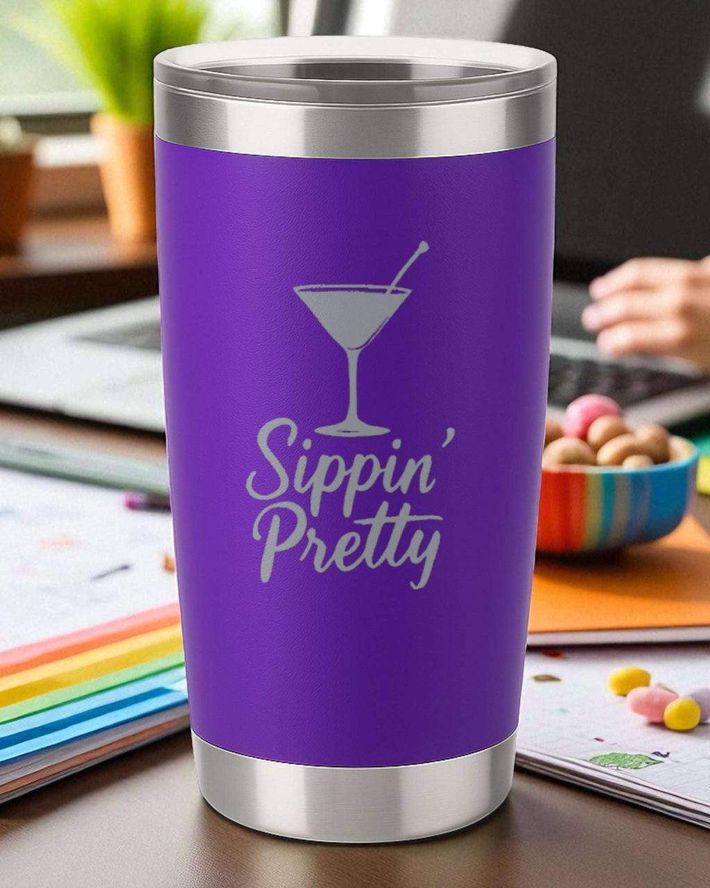 Purple 20oz stainless steel tumbler engraved with "Sippin' Pretty" and a martini glass design, double-walled insulation with clear lid.