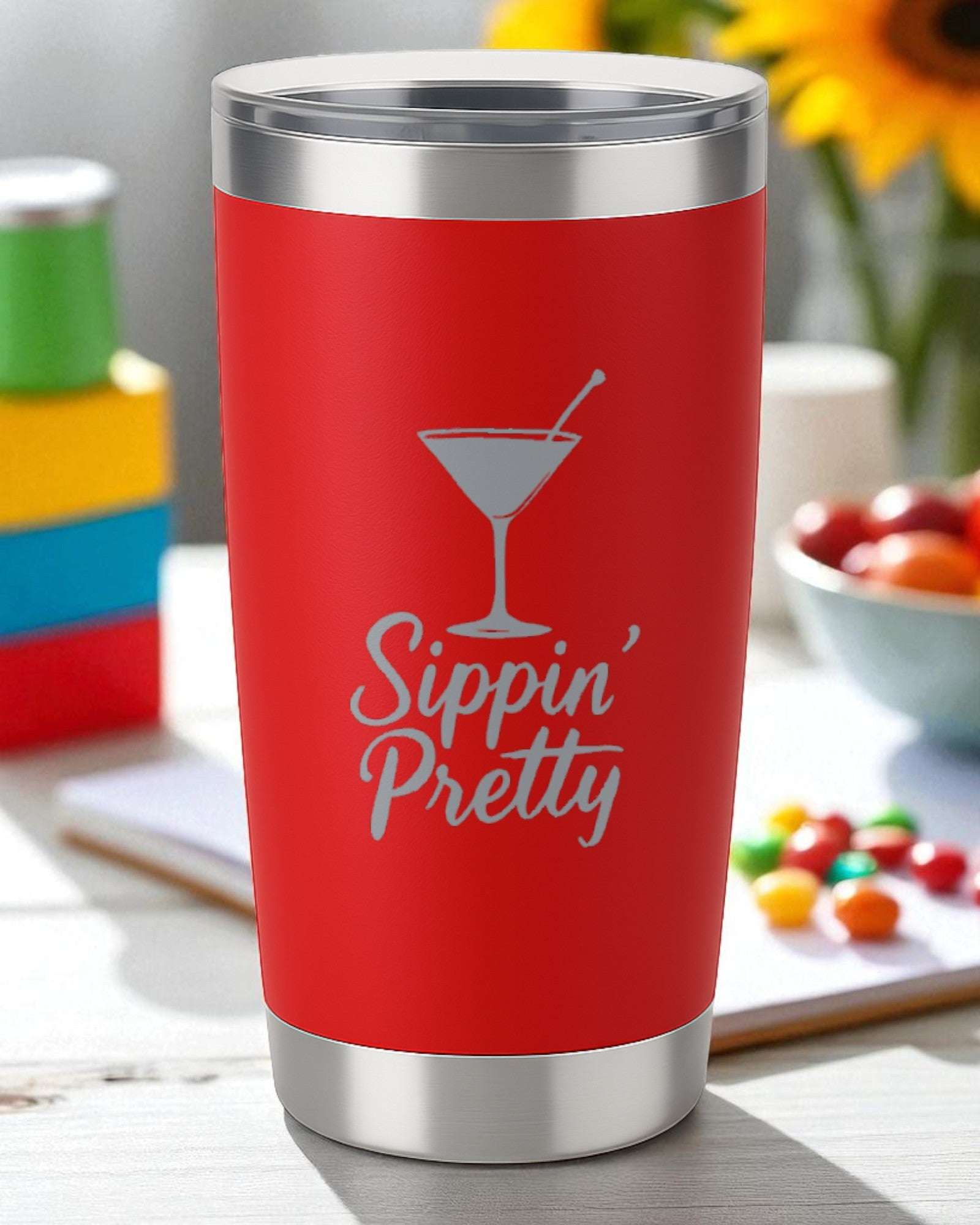 Red 20oz stainless steel tumbler with "Sippin' Pretty" engraved and a martini glass design, double-walled insulation and clear lid.