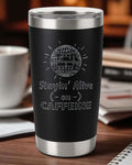 20oz black stainless steel retro coffee tumbler with laser-engraved "Stayin' Alive on Caffeine" design and clear lid