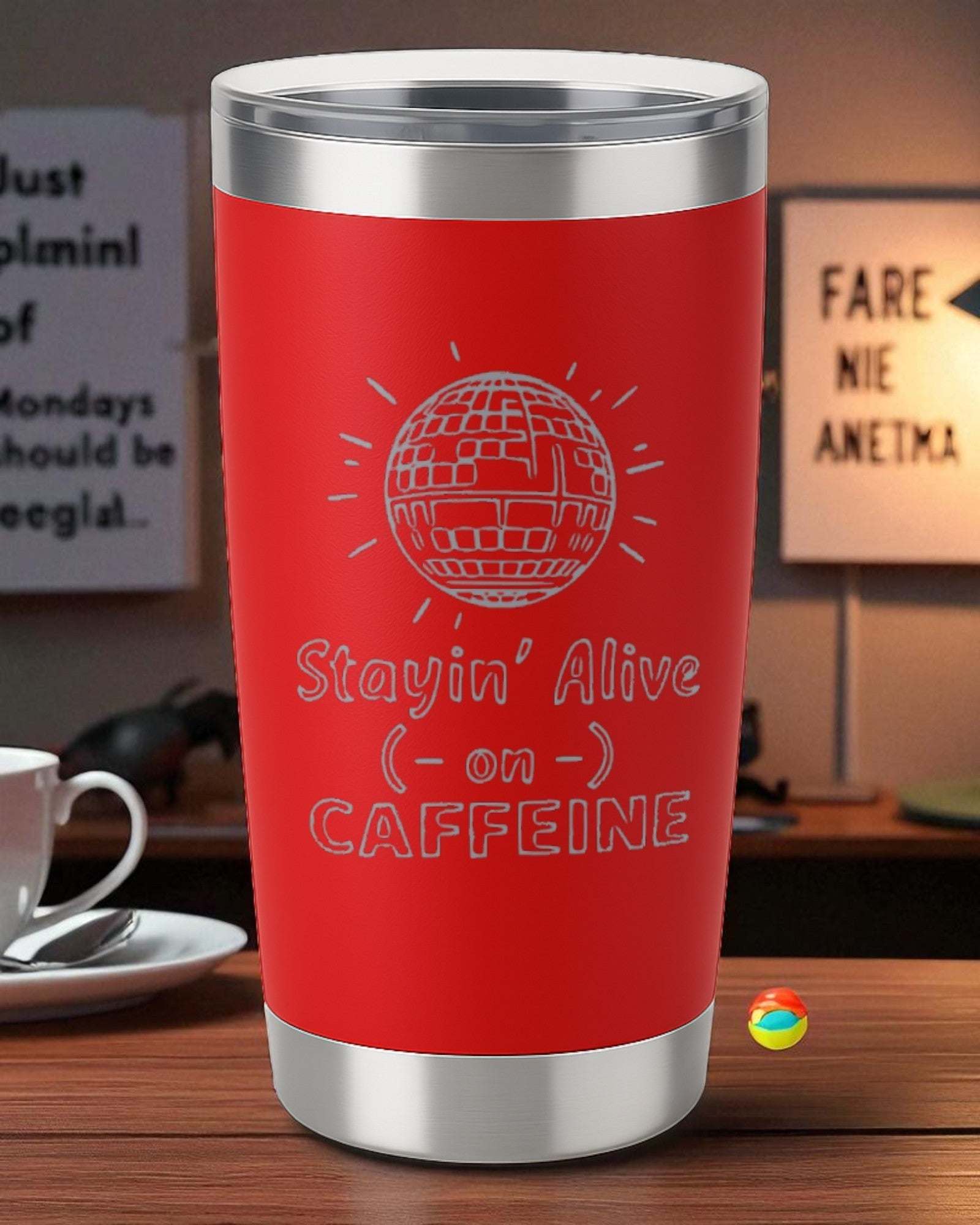 Red 20oz stainless steel retro coffee tumbler with "Stayin' Alive on Caffeine" laser engraving and clear lid.
