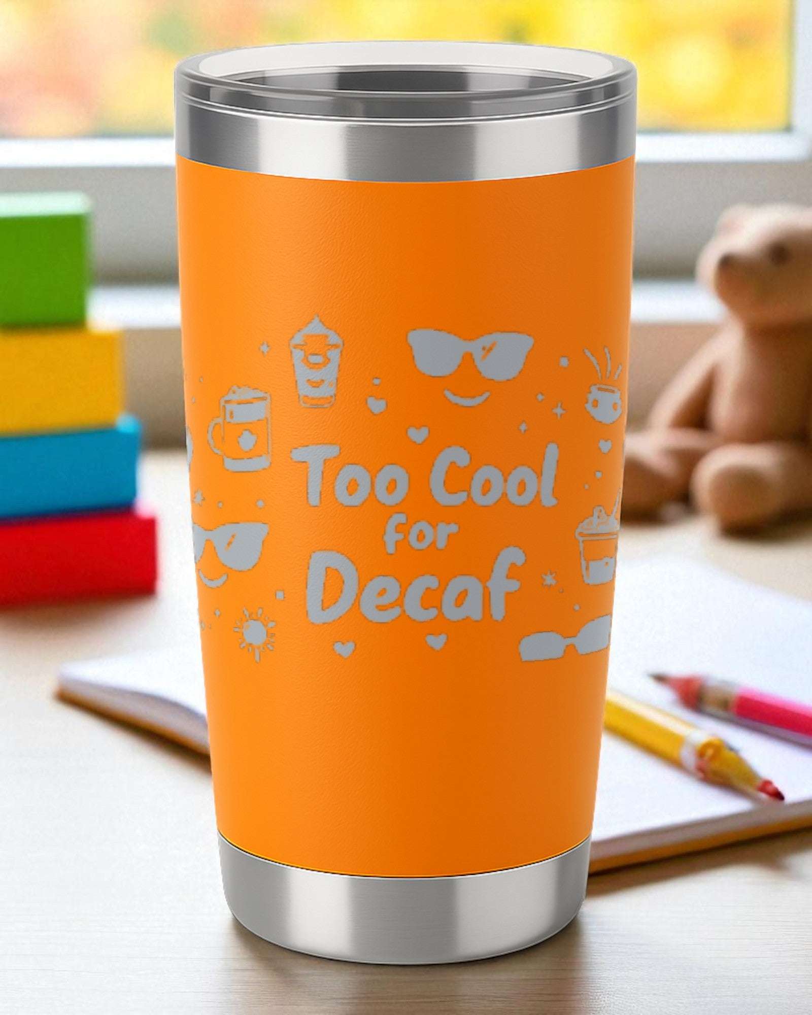 20oz orange insulated stainless steel tumbler with laser-engraved "Too Cool for Decaf" design and clear lid