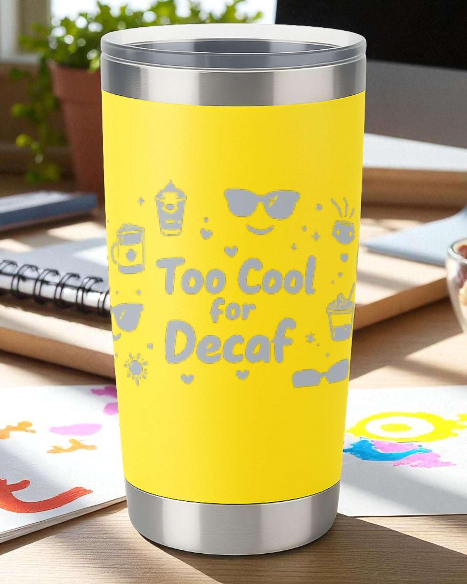 Yellow 20oz stainless steel insulated tumbler with engraved "Too Cool for Decaf" design and clear lid.