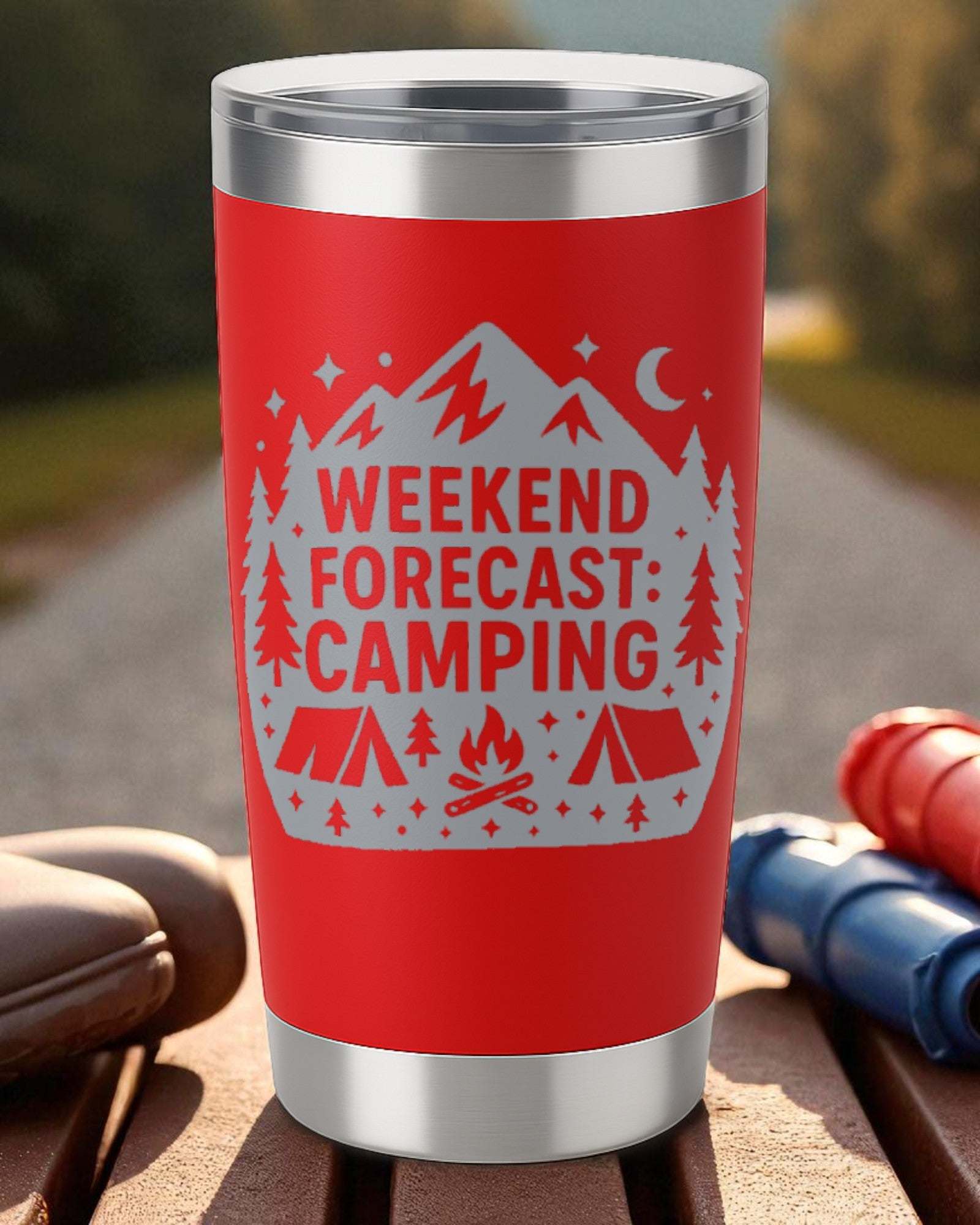 Red 20oz double-wall stainless steel tumbler with laser-engraved "Weekend Forecast: Camping" design featuring mountains, trees, tents, and campfire