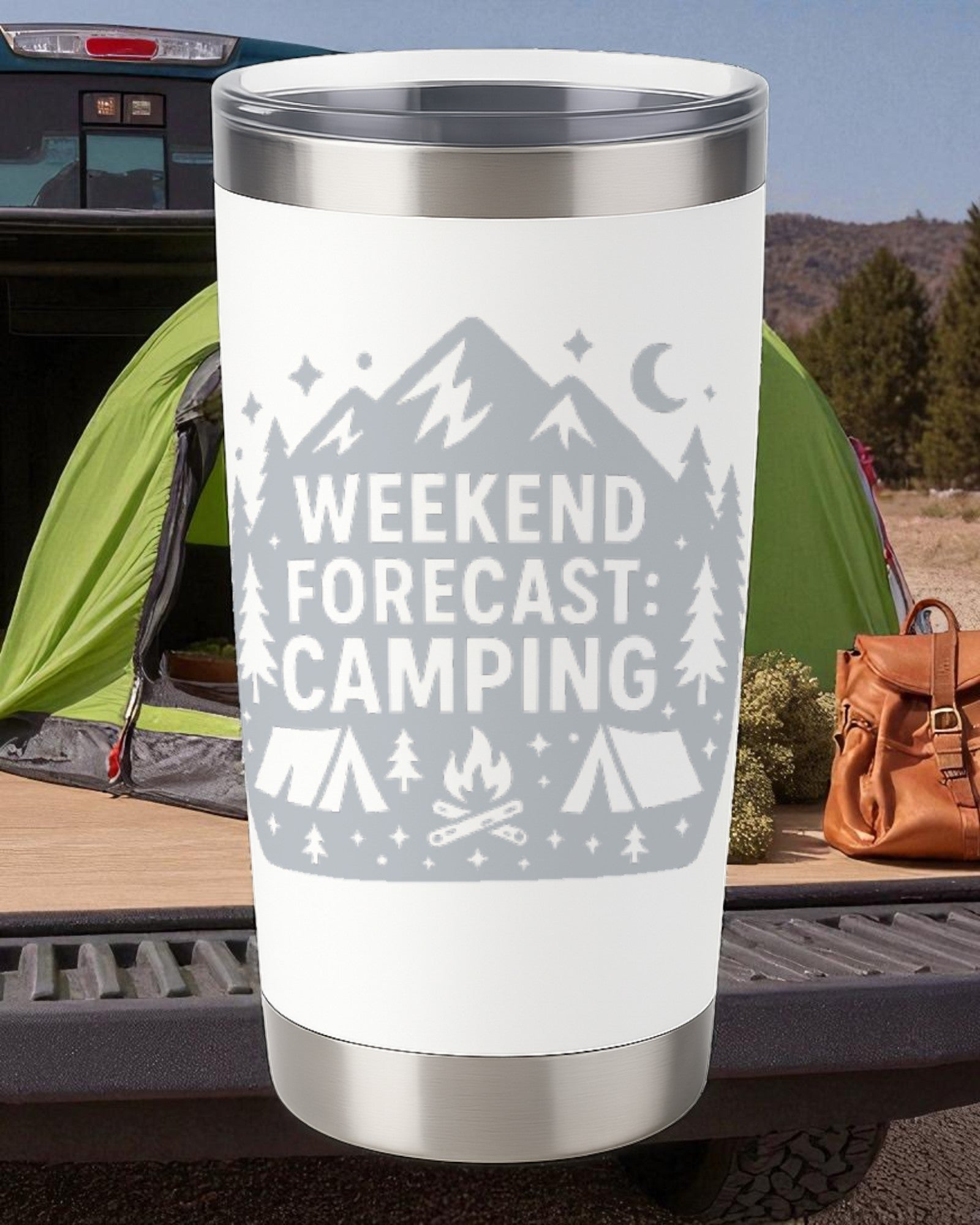 White 20oz stainless steel tumbler engraved with "Weekend Forecast: Camping" design against a camping backdrop