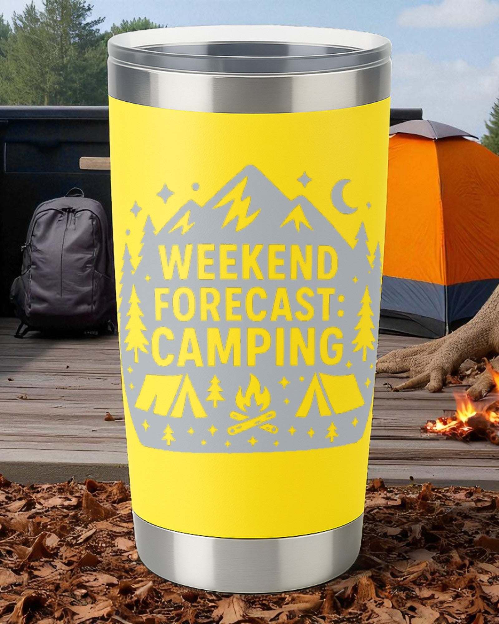 Yellow 20oz stainless steel tumbler with engraved "Weekend Forecast: Camping" design, set outdoors by a campfire and tent.