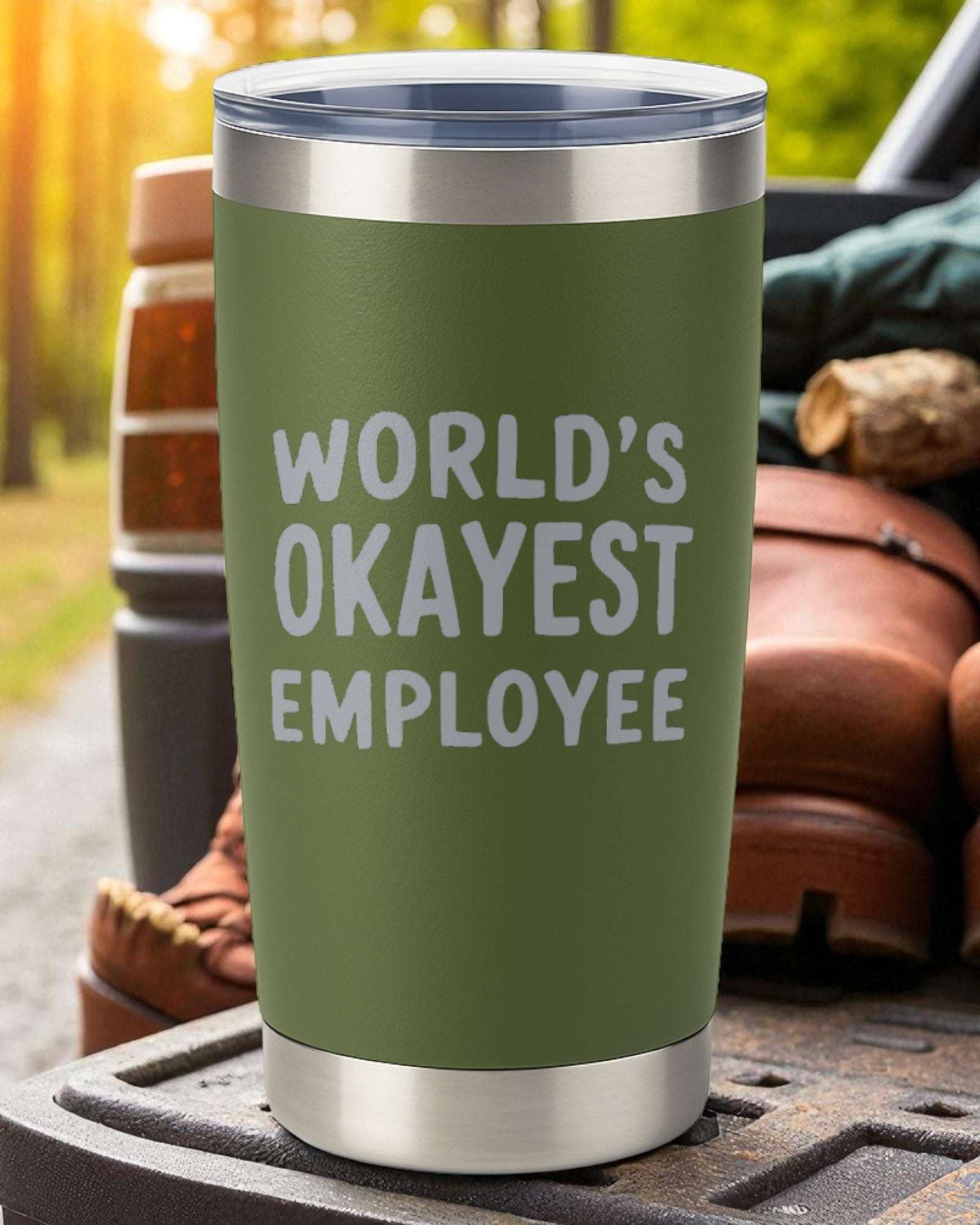 20oz stainless steel tumbler with "World's Okayest Employee" laser engraving and clear sliding lid