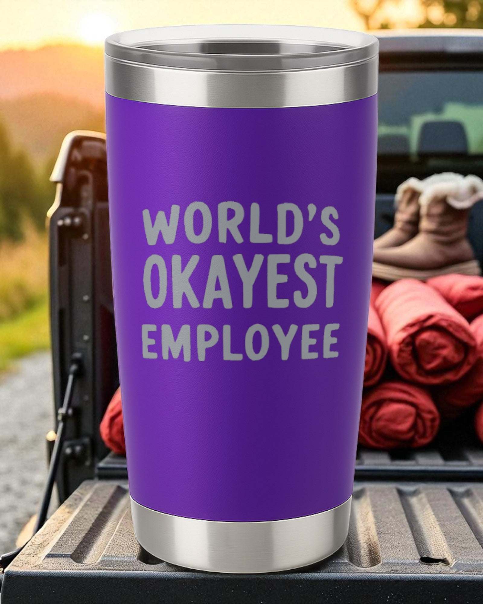 Purple 20oz stainless steel tumbler engraved with "World's Okayest Employee" text, featuring double-wall insulation and clear sliding lid.