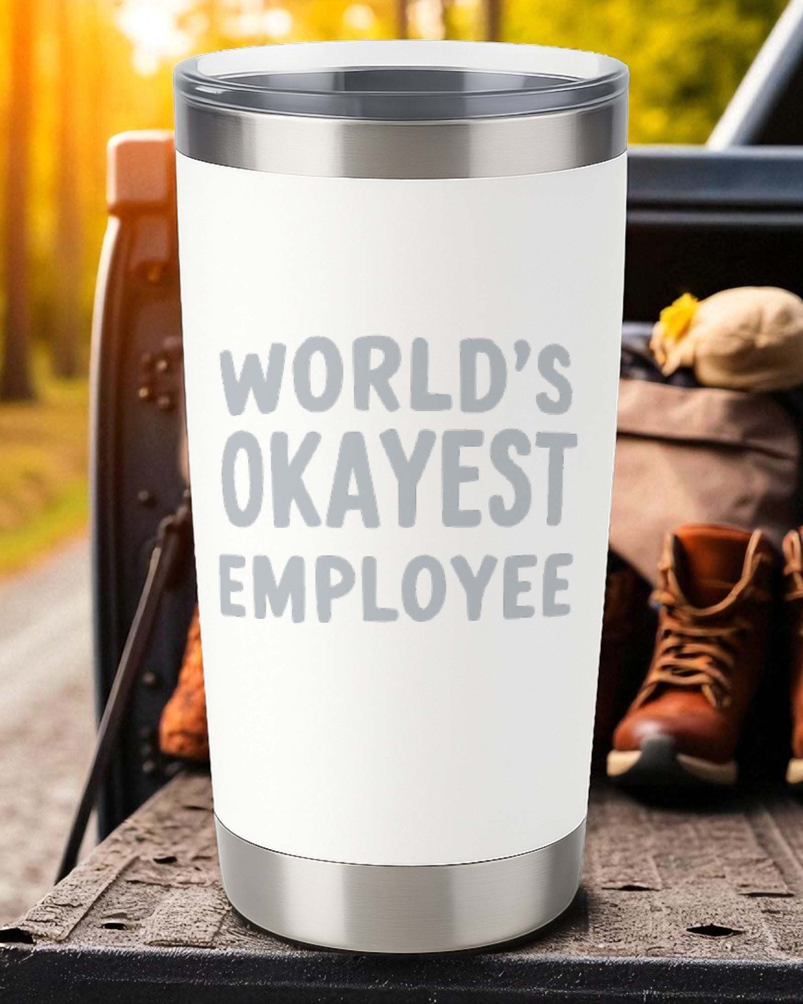 20oz stainless steel tumbler with "World’s Okayest Employee" laser engraving and clear sliding lid