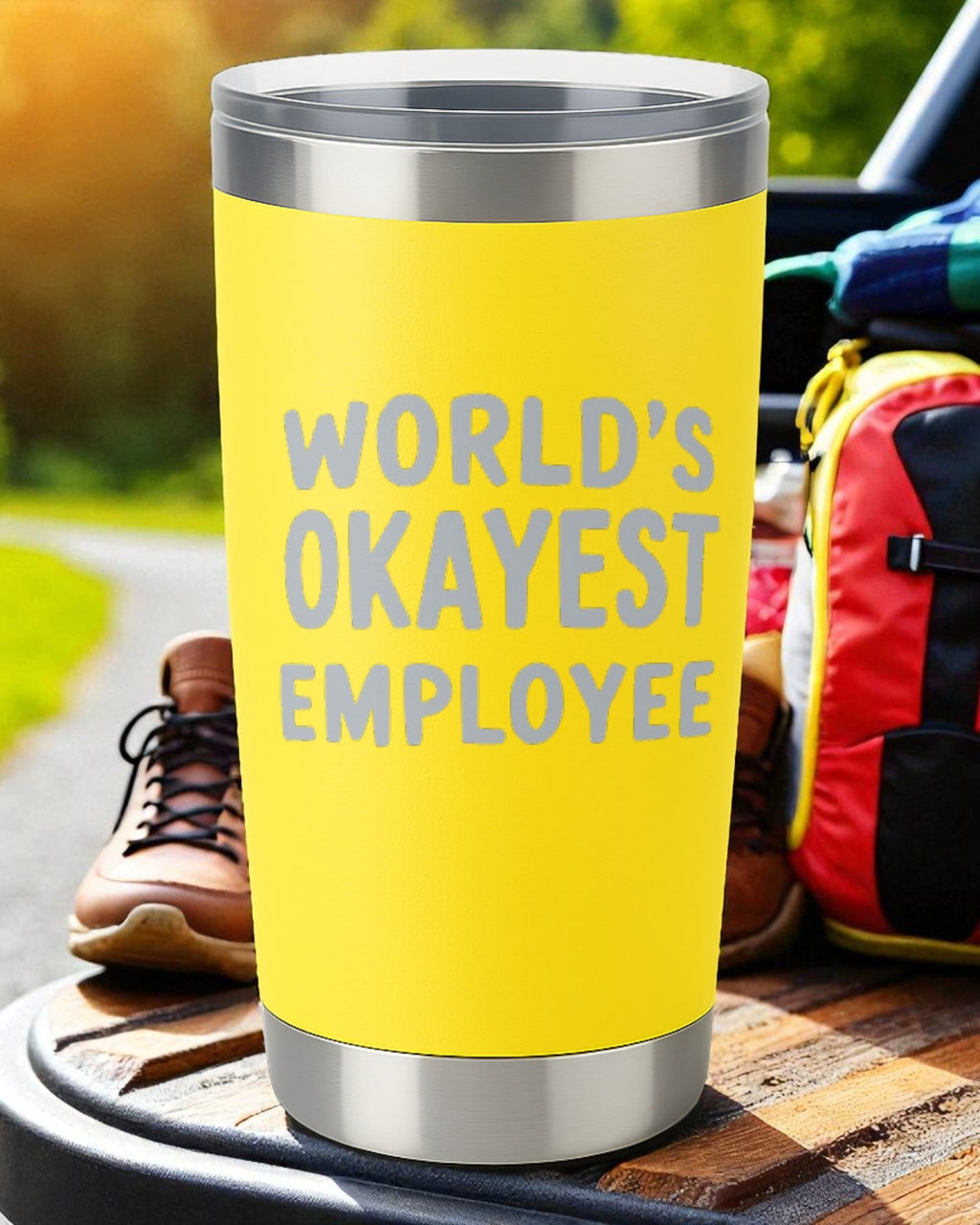 Yellow 20oz stainless steel tumbler engraved with "World's Okayest Employee" text for office humor gift