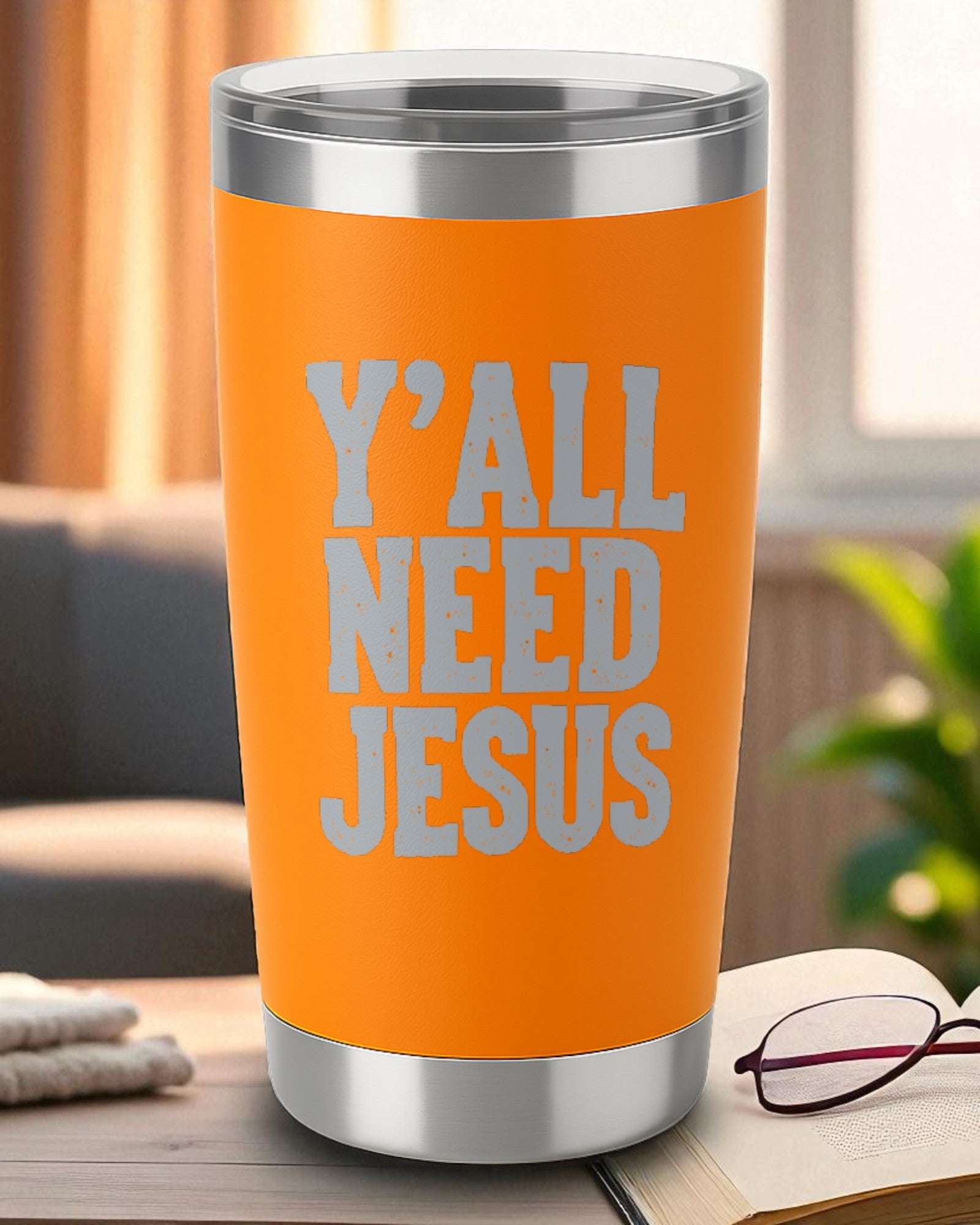 Orange 20oz stainless steel tumbler with engraved "Y'all Need Jesus" text and clear lid